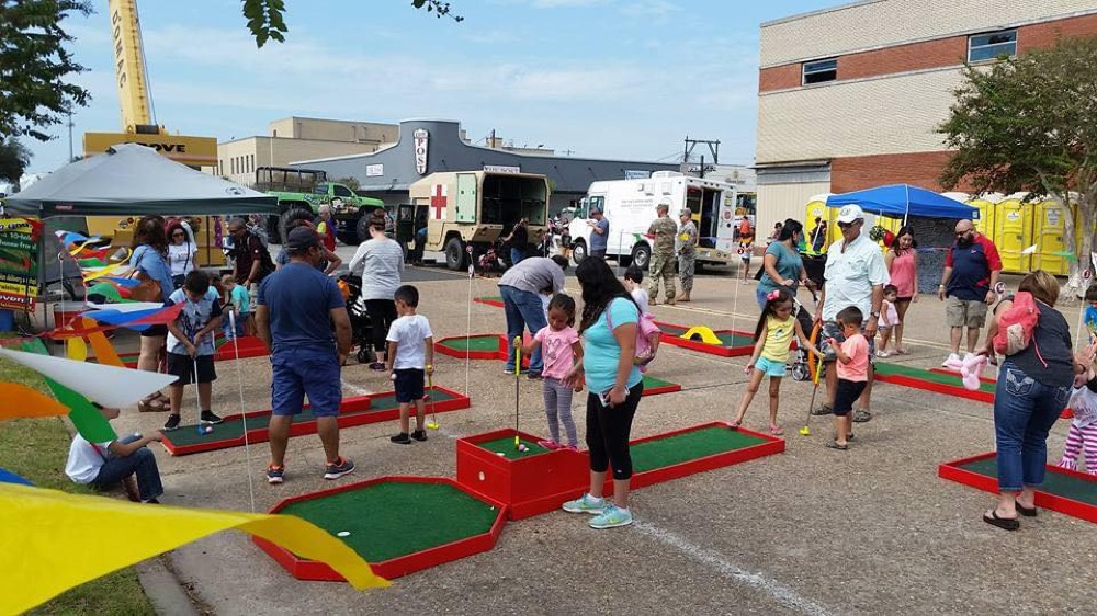 People Playing Mini Golf